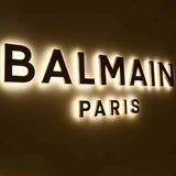 Wind-Load Optimized Backlit Signage for High-Rise Buildings